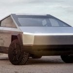 Tesla-Cybertruck-Electric-Pickup-Truck-Front-3-4-View-with-Off-Road-Lights-and-Headlights-Illuminated